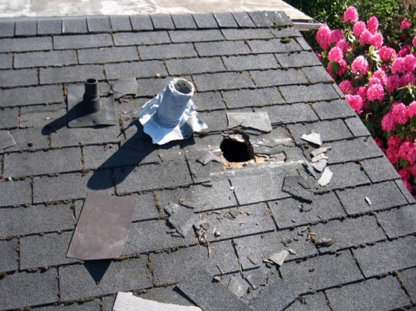 How do I know if I need a roof repair or replacement?